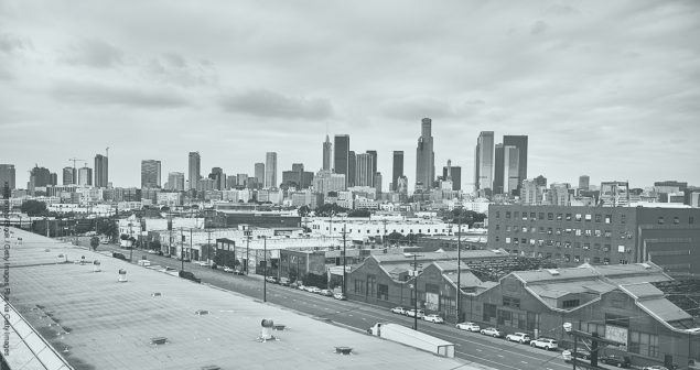 Downtown Los Angeles against cloudy sky. View of residential and office buildings in city. Travel concept.