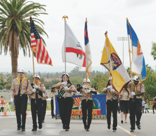 Pathfinders present the flags during the parade ceremony.