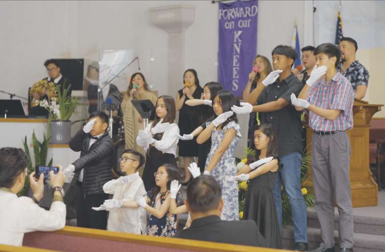 The Pathfinders share a special music in sign language to “Shout to the Lord,” accompanied by the praise team.