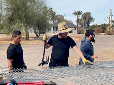 A group of volunteers led by Mason Aitken (center) began assembling the gabion cages last fall.