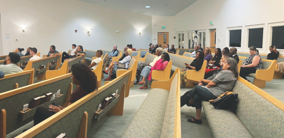 Attendees await the start of the screening of For His Name’s Sake at Riverview church.