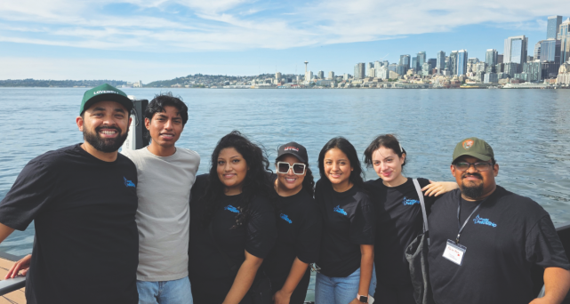 The Nevada-Utah Conference student delegation enjoys the Seattle skyline during a group outing on the water.