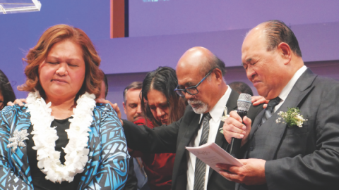 Pastors pray a blessing over Mauia.