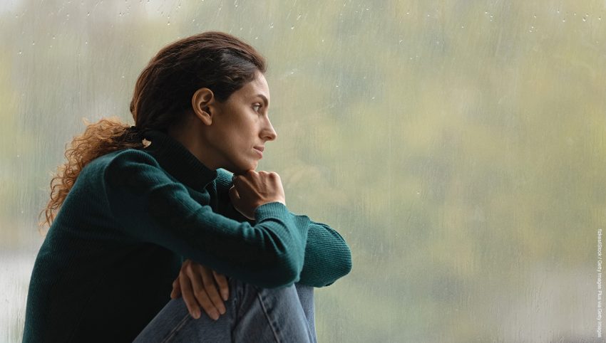 Side view frustrated thoughtful woman looking out rainy window in distance alone, lost in thoughts, upset unhappy young female feeling lonely and depressed, thinking about relationship problems
