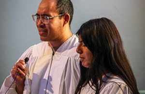 A student literature evangelist is baptized at the iShare Convention, a weekend-long event where student literature evangelists from the Pacific Union Conference gather to share testimonies and worship.