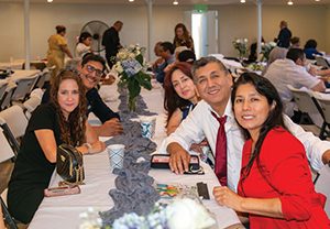 Attendees fellowship during potluck.