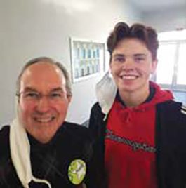 Gage, a ninth-grader, shared with Dan Serns, CCC president, why he now loves attending Armona Union Academy (AUA).