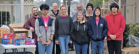 Students from Sierra View Junior Academy join with members of the Exeter church to provide food for needy families.