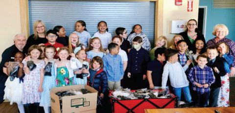 The K-4 students at Riverview Christian Academy are joined by Pastor Brian Bilbrey, their teacher, Mariann Beddoe, and others as they bag socks to donate to some of Reno’s homeless population.