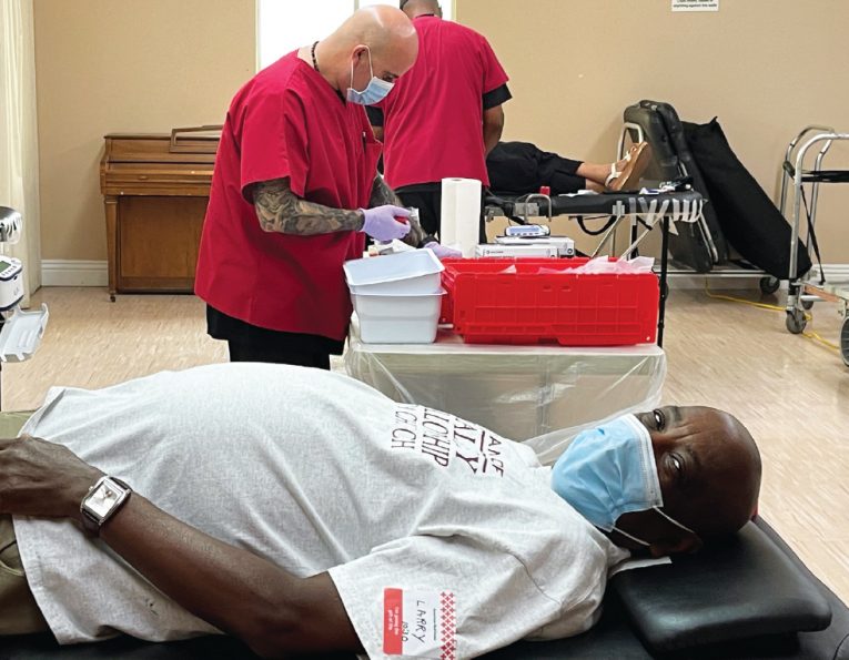 Larry Scott, Valley Fellowship elder, gives blood for the first time. 