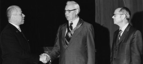 W.G.C. Murdoch being awarded a medallion of Merit in 1972 by Dr, Garland of the General Conference while University President Richard Hammill looks on.