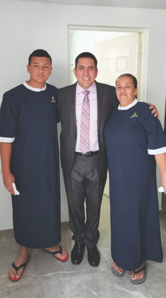 Pastor Ricardo Vargas, Camino a Cristo church, Las Vegas, with two of the 94 baptismal candidates.