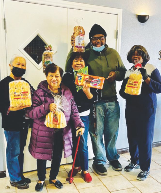 From left to right: Edie Sandro, Beth Rodriquez, Tess De Castro, Derrick Stewart, and Liz Holland display some of the blessings of the Daily Bread ministry.