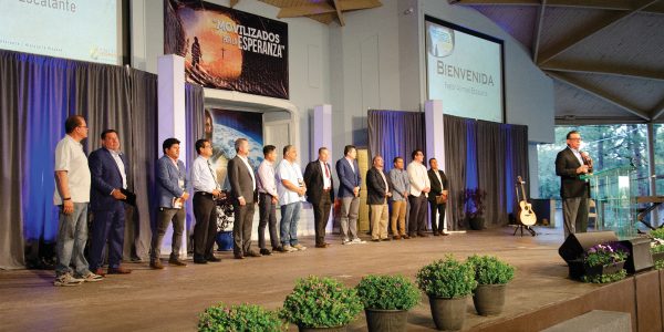 Elder Abimael Escalante introduces each Hispanic pastor to the audience at the Hispanic Ministries Camp Meeting.