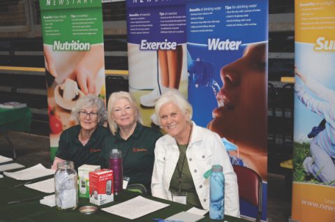 Volunteers at the healthy living booth.