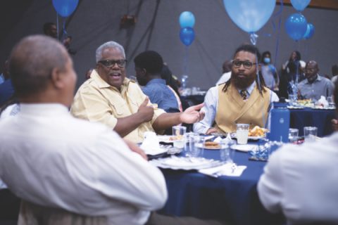 Ronald Goldsmith (left) and Malik Mayne connect during men’s lunch.