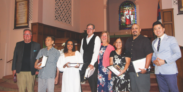 (Left to right) Southern California Conference West Region Director Greg Hoenes, Yohan, Hasitha, Michael, Cindy, Rachelle, Celin, and Park on the day of the baptism.