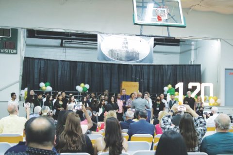 Rugless directs a mass choir of current and former students.