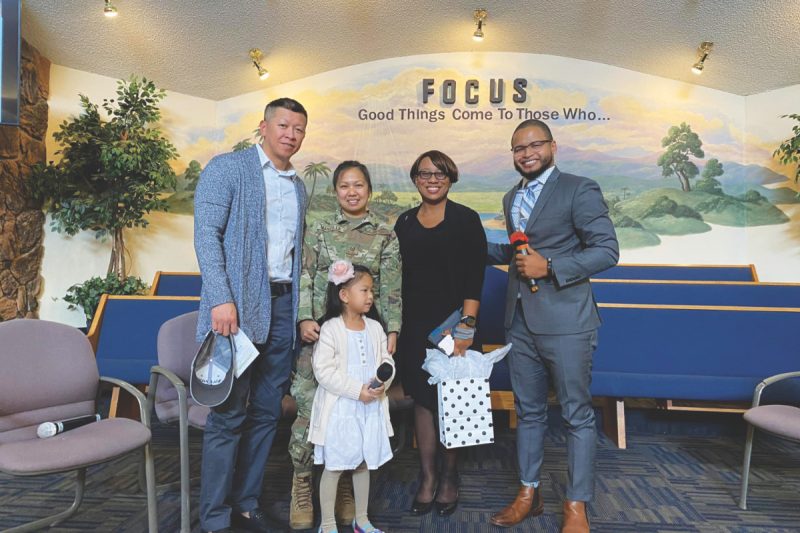 John DeGuzman, Sandelle Mancilla, and their daughter, Alliana, join Connie Hall and Neat Randriamialison at the Sparks church celebration.