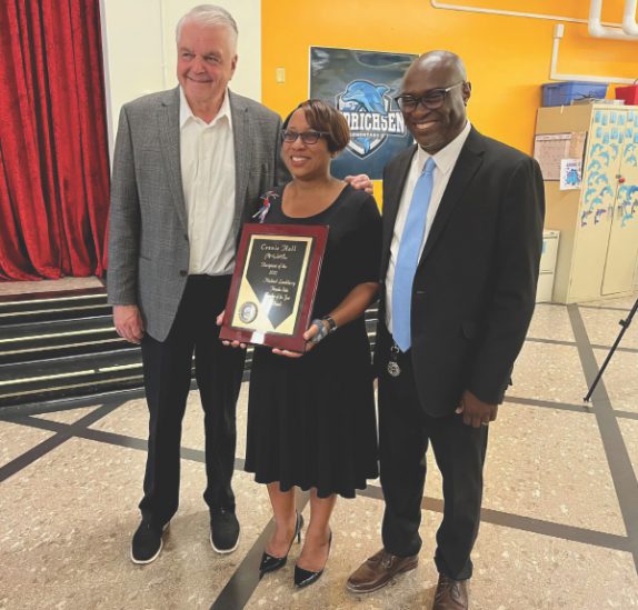 Nevada Governor Steve Sisolak names Connie Hall the Nevada Teacher of the Year, while her husband David Solomon Hall Sr. proudly looks on.