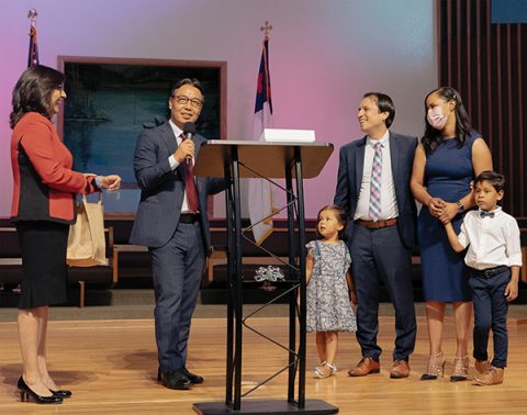 Officers present gifts to the Santos family.