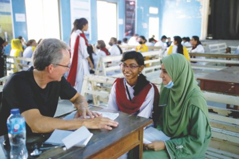 Dr. Jon Opsahl counsels with some of the students at the Pakistan Adventist Seminary and College.