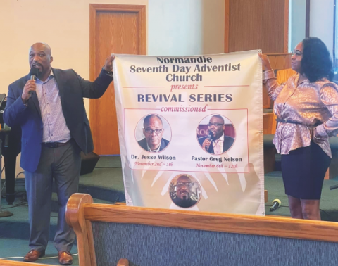 Chatman (left) presents to the congregation the revival series at Normandie Avenue church.