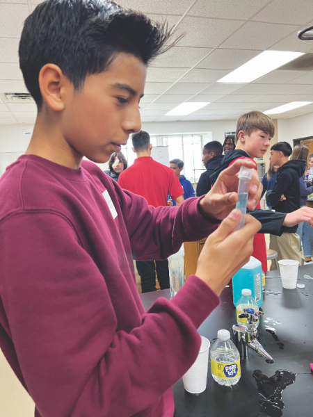 Students enjoy a science experiment.