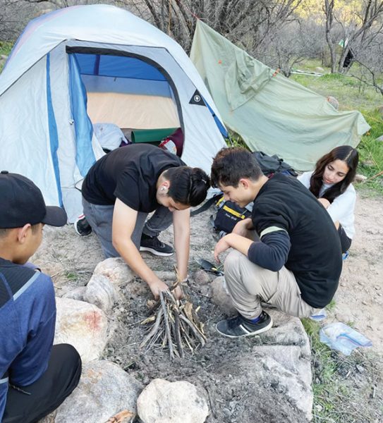 TAA students putting their Pathfinder camp firing making skills to the test.